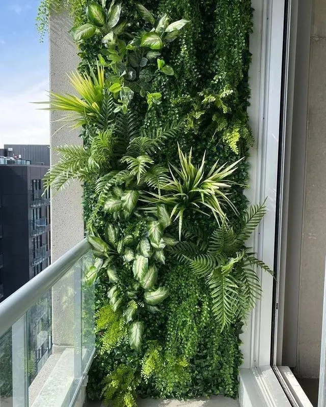 Even a small balcony can become a lush escape. We designed and installed this custom artificial vertical garden, creating a vibrant, maintenance-free wall of greenery that adds life and privacy to this urban apartment.