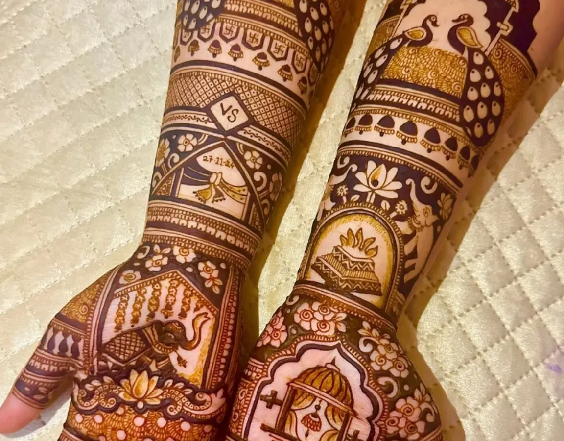 I love creating these grand, royal-themed designs. This Rajwada style mehndi features majestic elephants, proud peacocks, and a doli scene, all brought together with intricate patterns. It’s a statement piece for the bride who wants to feel like a queen.