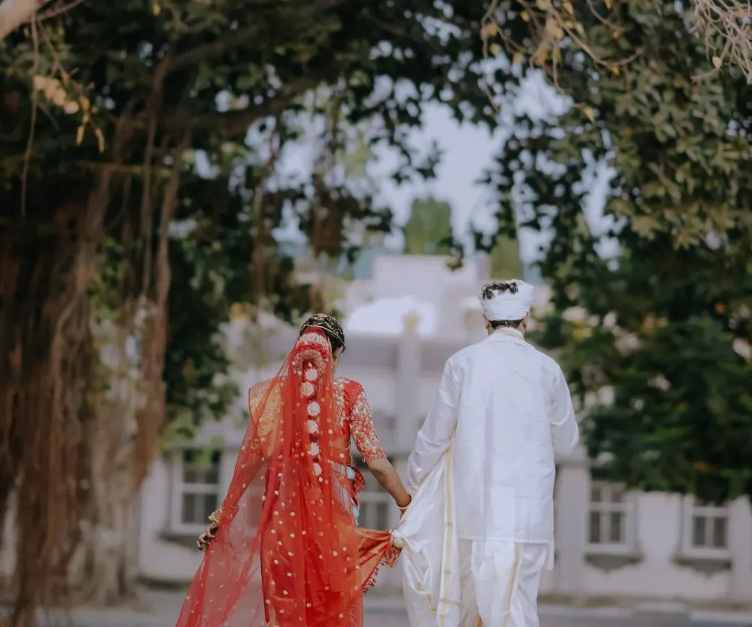 A walk into forever, hand in hand. This moment from a traditional South Indian wedding in Tirupati captures the beautiful beginning of a new journey. My team and I specialize in destination wedding management, ensuring every tradition is honored, no matter where your story takes you.
