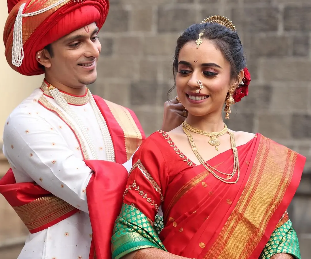 A classic Maharashtrian groom look for a wedding ceremony. I styled the traditional red Pheta and ensured his makeup was flawless yet understated, perfectly complementing the bride's divine look for their special day.