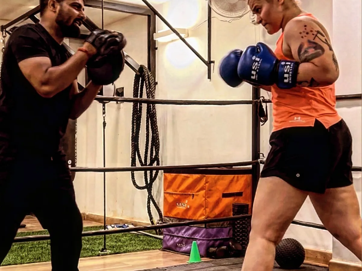 In the ring, it's just you, me, and the goal. I focus on every detail of your form, making sure each punch you throw is stronger and sharper than the last. This is one-on-one coaching at its most intense.