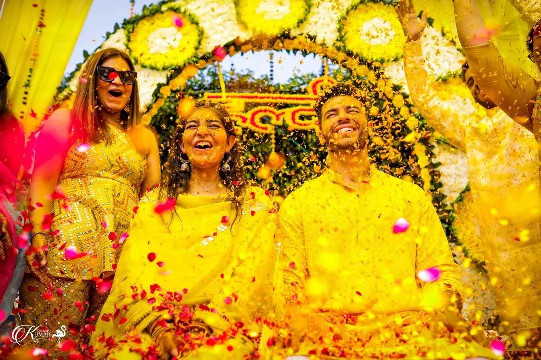 The pure joy and fun of a Haldi ceremony, as the couple is showered with flower petals by their friends and family. We aim to capture the high energy and candid laughter of these moments.