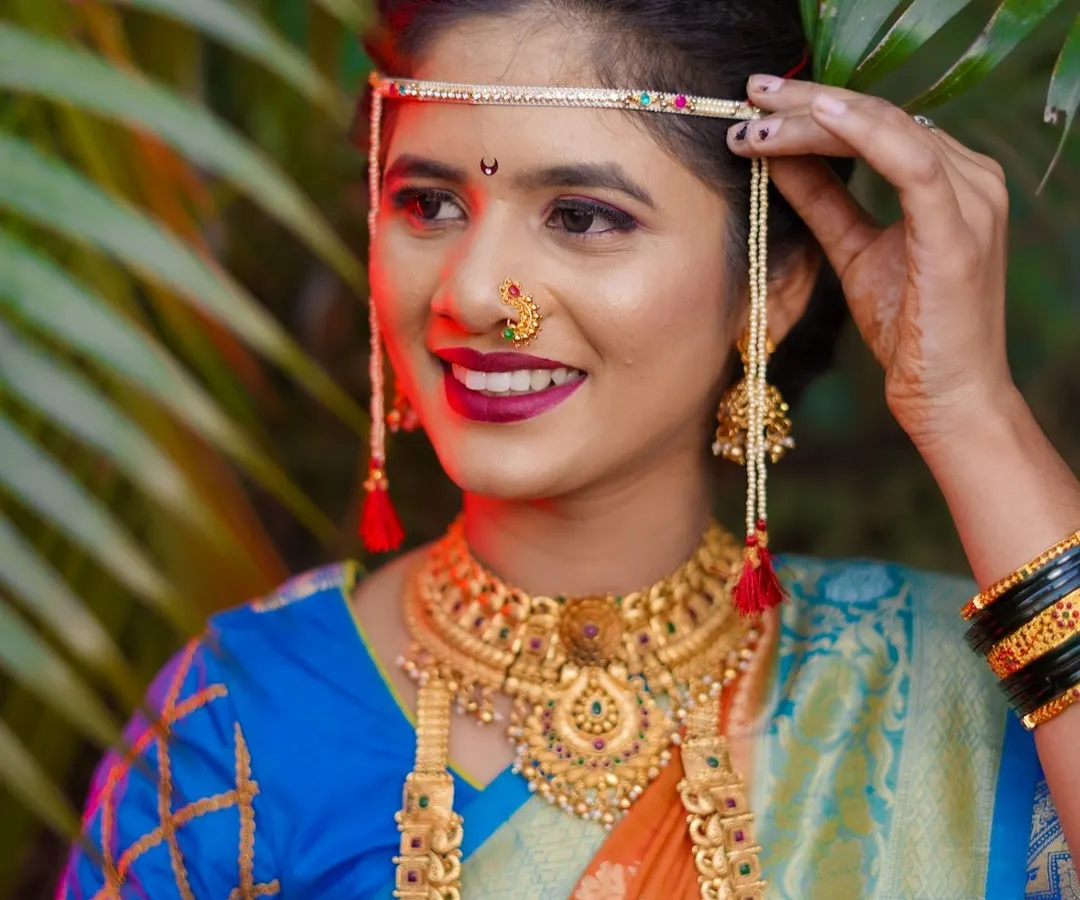 I believe every Maharashtrian bride is a work of art. In this portrait, I focused on the beautiful details of her look, from the traditional mundavalya and gold jewellery to her happy, confident smile. Creating these classic bridal portraits is one of my favorite parts of the wedding day.
