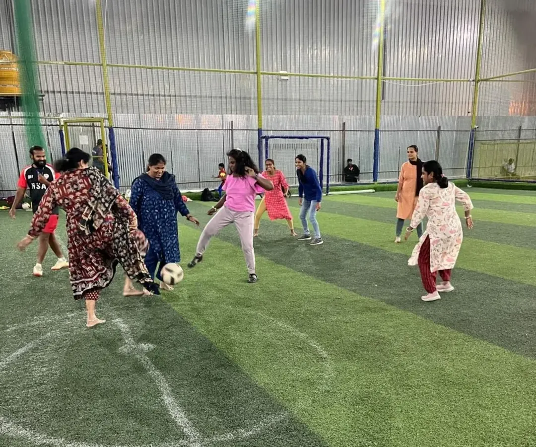 Football is for everyone. Here, you'll find a welcoming and supportive environment where adults of all genders and skill levels come together for the love of the game. This shot from our community fest captures the pure joy and camaraderie we foster.