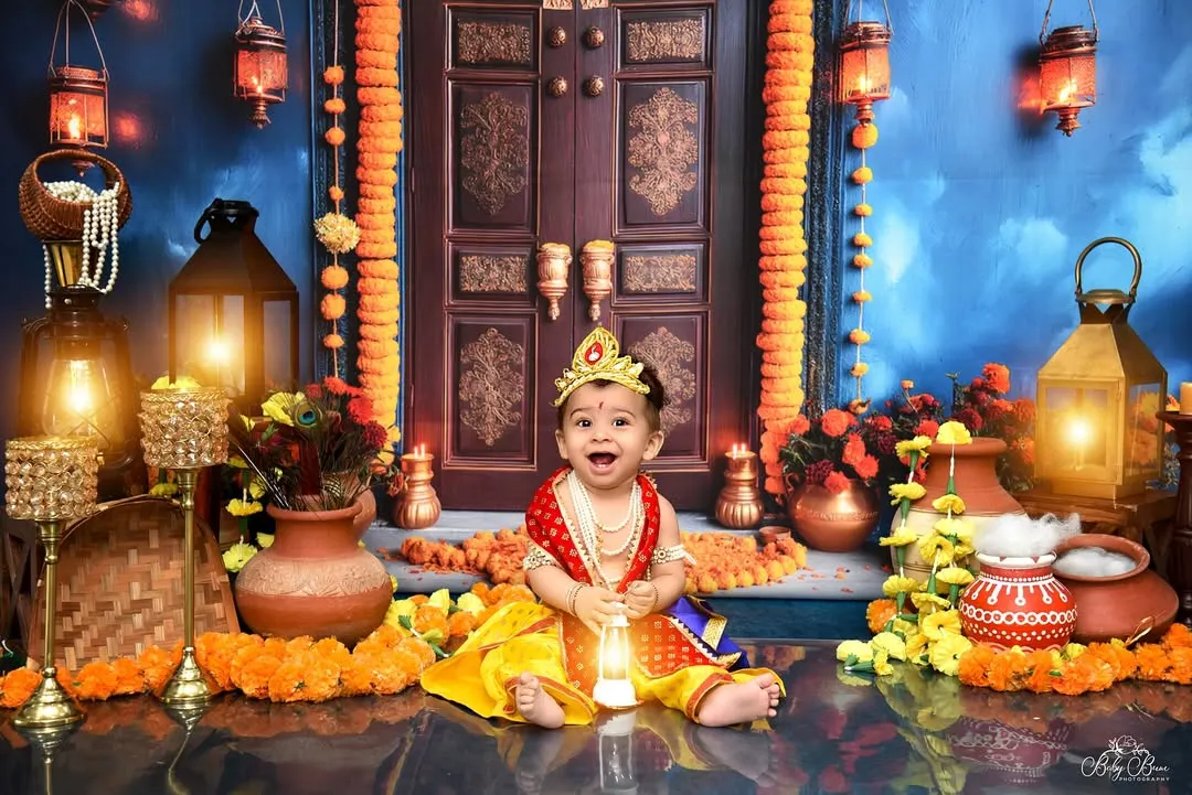 I create elaborate, culturally rich setups like this beautiful Krishna theme for Janmashtami. Every detail, from the lighting and marigolds to the traditional attire, is carefully planned to create a divine and memorable portrait.