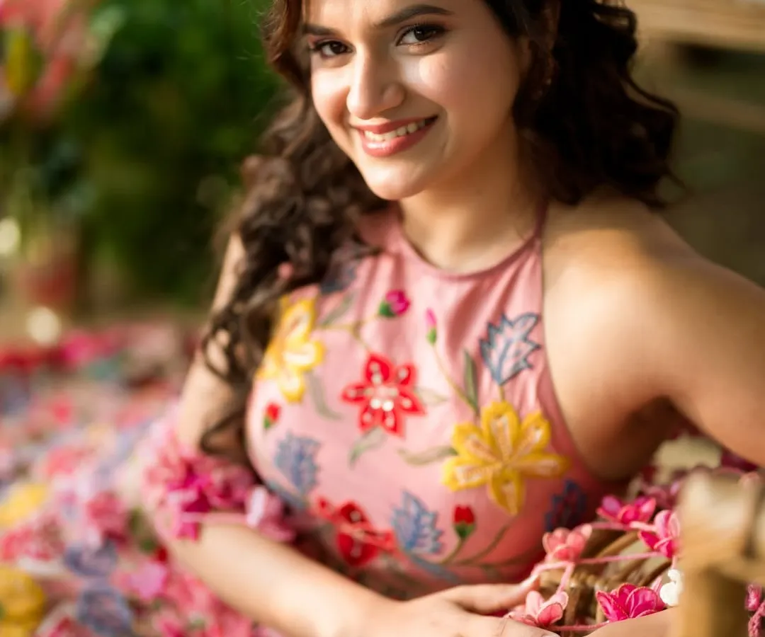 For Yogita's Mehendi, we created a look that was as fresh and vibrant as the floral setting. I focused on a natural, dewy base and a soft pink lip to complement her stunning floral outfit, making her look like she stepped right out of a fairytale.