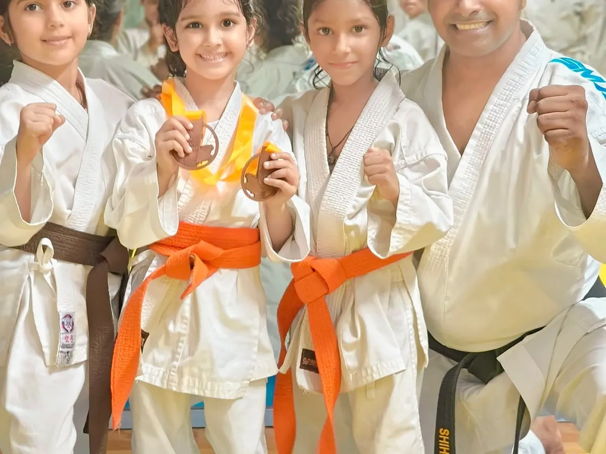 I believe in celebrating every achievement. Here I am with some of our youngest champions, proudly showing the medals they earned through their hard work and dedication in karate competitions.