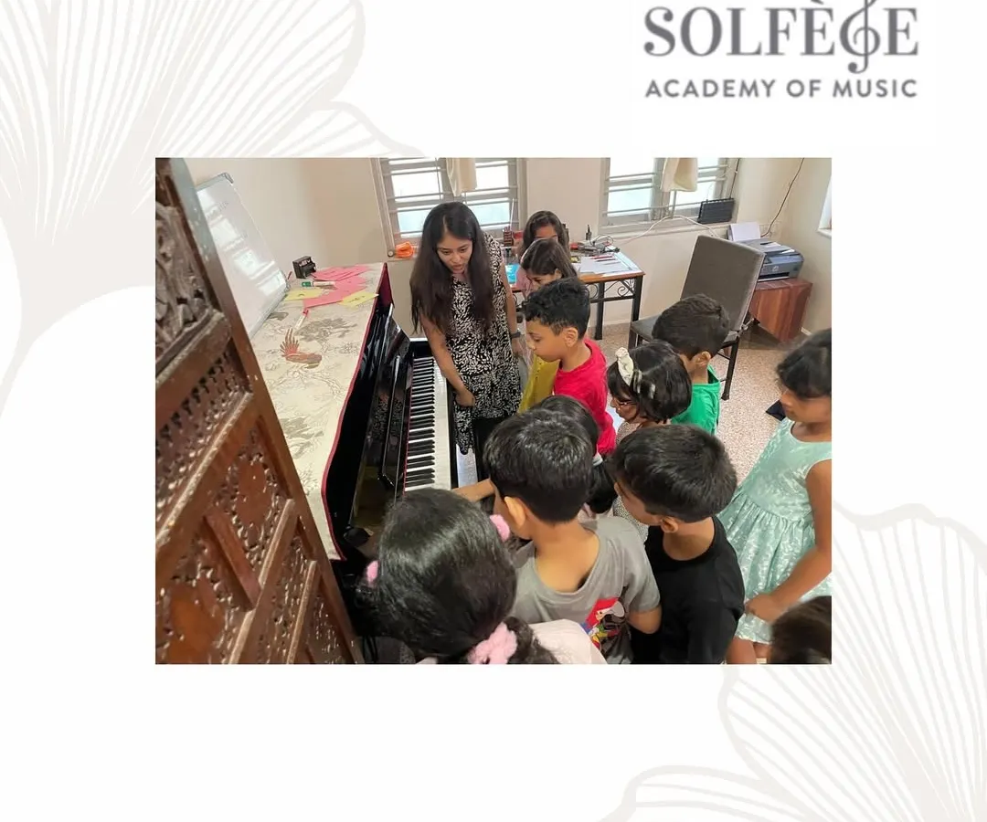 Curiosity is the first step in learning. I captured this moment during a music theory workshop where the children gathered around the piano, eager to see how the notes they learn on paper translate into sound. We encourage this hands-on exploration in our group piano classes.