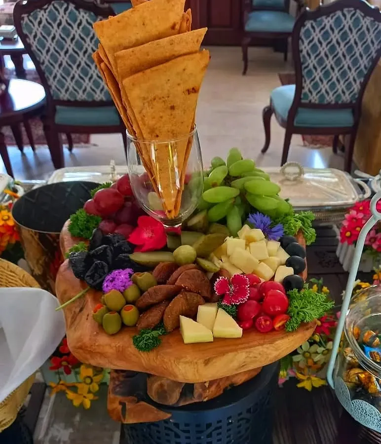 Beyond the classics, I create stunning continental platters that wow your guests. This beautiful cheese board, with a mix of cheeses, fruits, and crackers, is a perfect example of how I can add a touch of modern elegance to your menu.