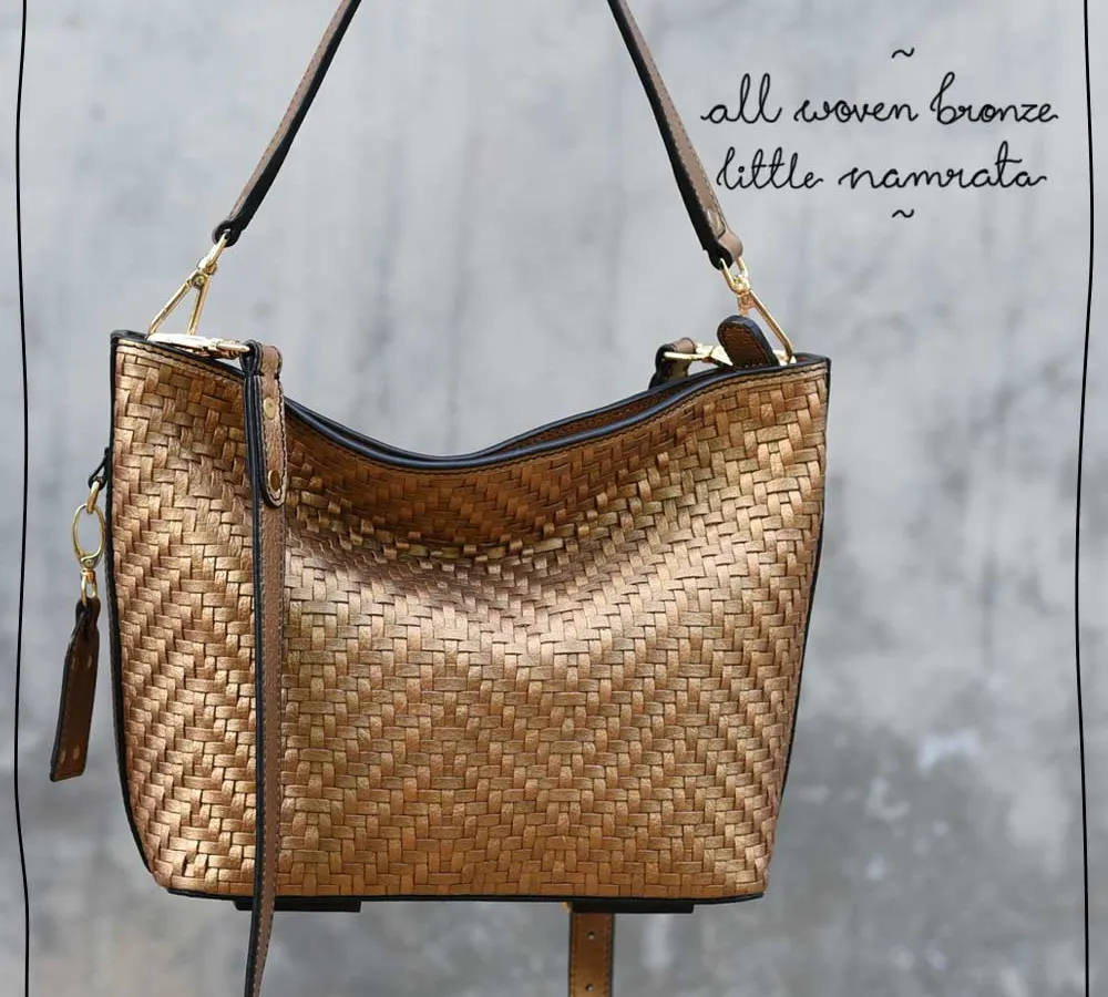 Our All Woven Bronze Little Namrata is a real showstopper. The metallic bronze leather is handwoven into this intricate pattern, creating a bag that is both a statement piece and a versatile accessory for evening outings. Each strip is cut and woven by hand by a single artisan.