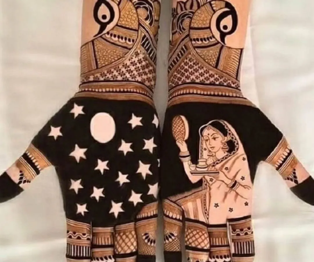 For Karwa Chauth, we can do something truly special. Here, I created a scene of a woman with the chalni and thali, looking at the moon against a night sky full of stars. This is a modern take on a classic festival mehendi design.