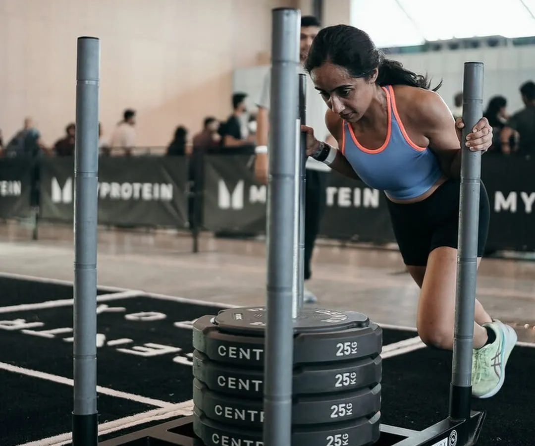 This is what "Strong > Skinny" looks like in action. My coaching focuses on progressive overload with strength workouts like this sled push. We build muscle to boost your metabolism, so you look toned and feel powerful, not just smaller.