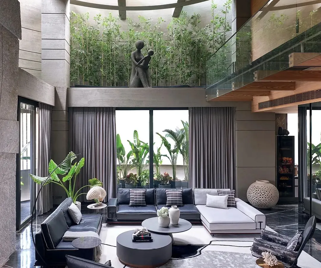 To bring nature inside, I designed this double-height living space around a central green courtyard. The large glass walls and open layout blur the line between indoors and outdoors, creating a sanctuary of calm and light.