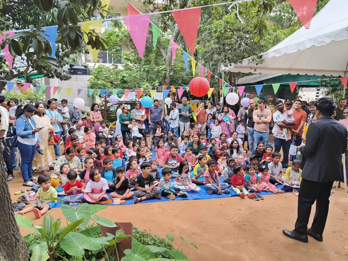 No crowd is too big. Here I am entertaining a large audience at an outdoor community event in Bangalore. My shows are designed to capture the attention of everyone, from the kids sitting up front to the parents in the back.