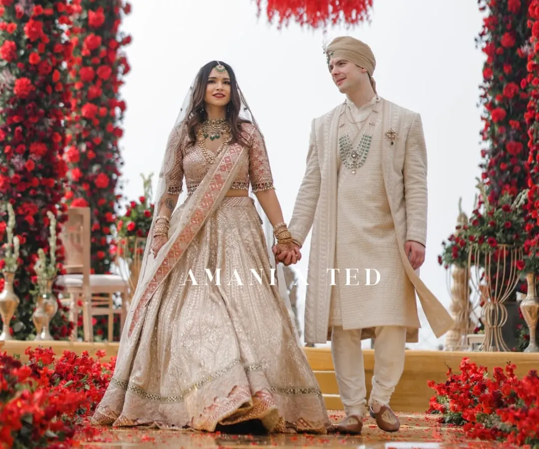 The grand walk down an aisle of roses at a breathtaking Goa wedding. I focus on capturing the scale and beauty of your day, ensuring every detail of your magnificent celebration is preserved forever.
