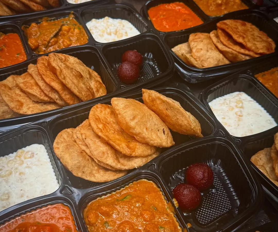 Here's a look at a bulk order of my Jain thalis, packed and ready for delivery. Each meal is sealed in a spill-proof container to keep the food fresh, warm, and neatly separated.