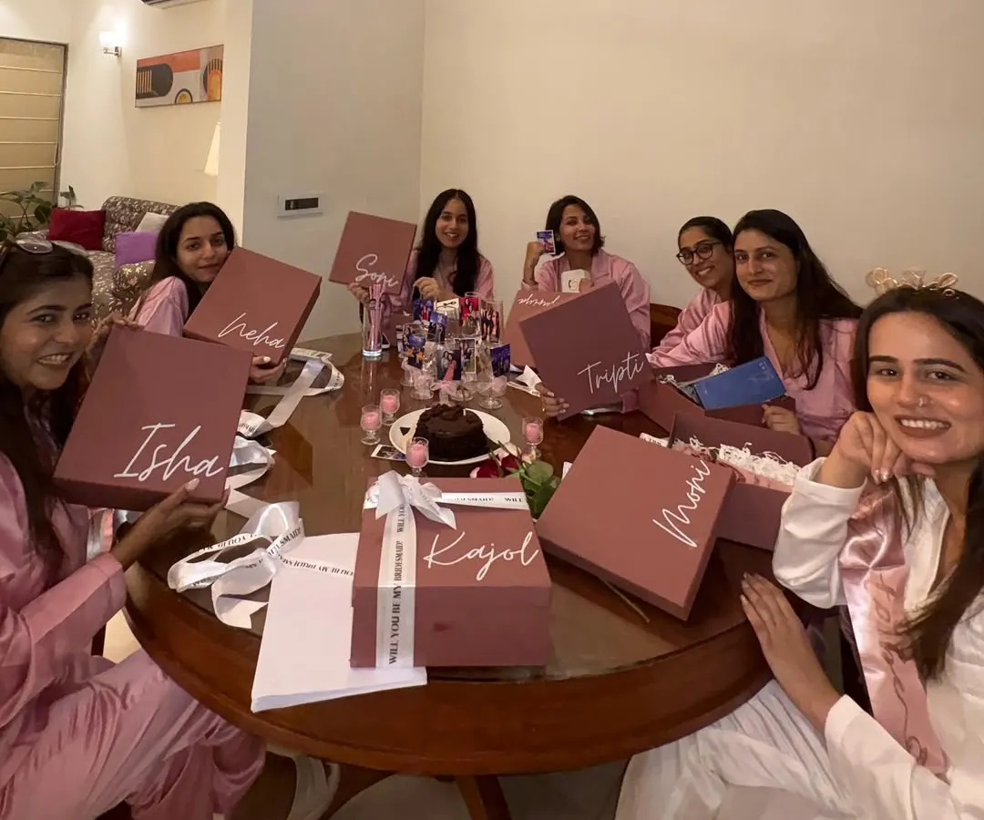 Nothing makes me happier than seeing a bride tribe this thrilled. I created these personalized dusty rose boxes for a bridal shower, each with the bridesmaid's name, making the moment they were asked to be part of the wedding extra special.