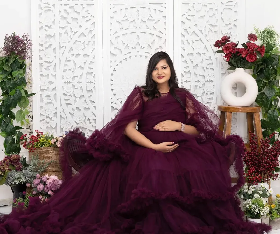 Feel like royalty in one of my lavish gowns. This portrait was taken in my Jaipur studio, using an elaborate floral set to create a rich, luxurious atmosphere for this special memory.