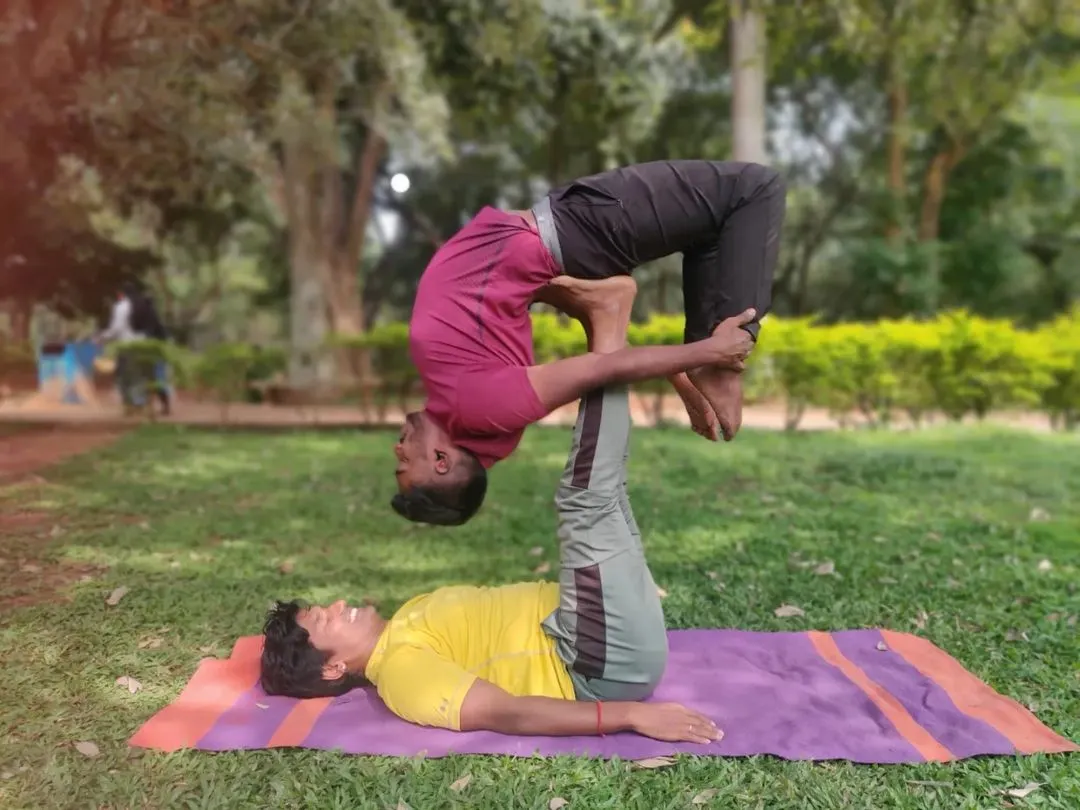 AcroYoga is a practice of trust and letting go. Here, we're exploring an Urdhva Dhanurasana (Upward Bow Pose) variation, relying on balance and communication. It’s a playful way to build strength and connection.
