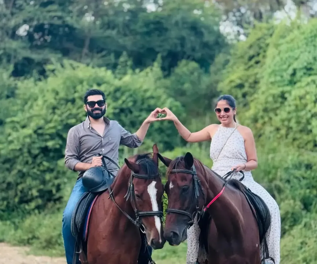 Create a memory you will both cherish forever. Our guided trail rides offer a unique and romantic escape for couples, with quiet moments and beautiful scenery, like this couple sharing a special moment with their horses.