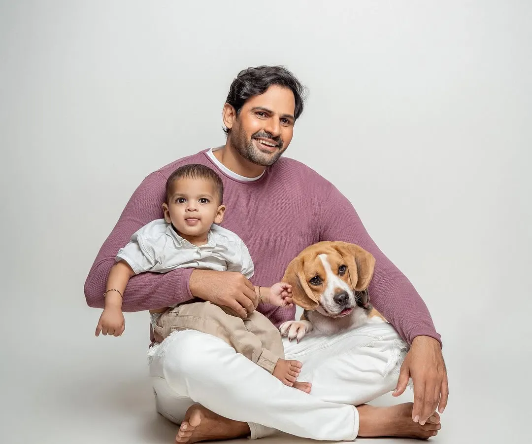 In the studio, my goal is to keep it simple so your family's connection shines through. This portrait of a new dad, his baby, and their ever-loyal beagle is a perfect example of the timeless, clean, and heartfelt images we can create together.