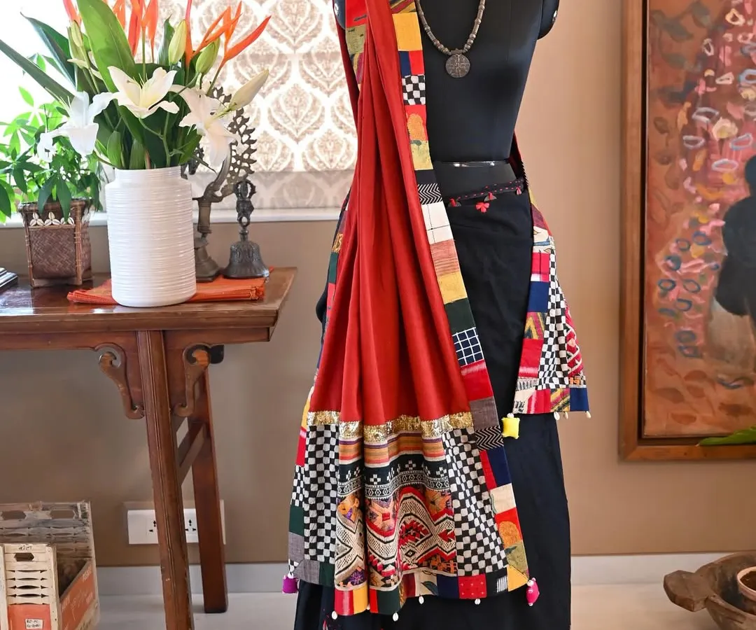 A bespoke wrap that marries the weaving traditions of two distinct cultures. This piece combines a vintage 'Tin Sinh' tribal silk from Laos, featuring a Naga serpent motif, with the earthy texture of hand-woven Kala cotton from Kutch, Gujarat.