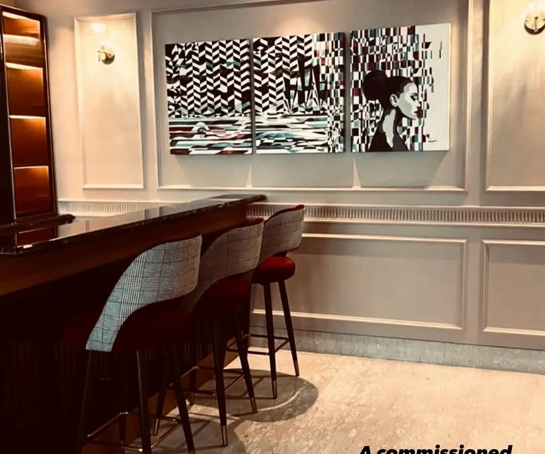 Art should live and breathe in your space. This commissioned triptych, a set of three monochrome paintings, was created for a young couple's paradise, their home bar. It shows how we can collaborate to create a statement piece that perfectly complements your interior design and personal style.