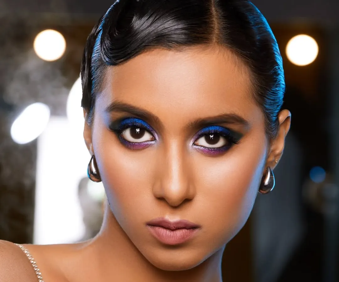 For this high-fashion concept, I created a vibrant cobalt blue smokey eye, paired with vintage-inspired finger waves. This demonstrates my skill in executing bold, colorful makeup for editorial and magazine shoots where making a statement is key.