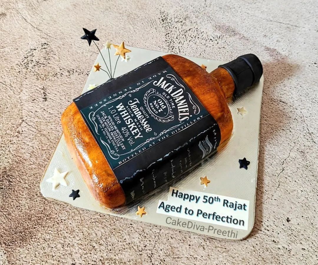 Aged to perfection, just like the celebration! This Jack Daniel's bottle cake is carved and detailed to look just like the real thing, making it the perfect surprise for a milestone 50th birthday. I can replicate any of your favorite bottles into a delicious cake.