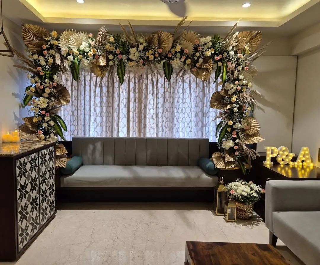 This is how we bring luxury home. For an intimate Roka ceremony, we created this stunning floral arch with golden palms and soft roses, turning the living room into a sophisticated and warm space for a beautiful new beginning.