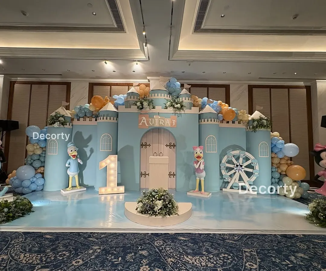 A full-scale Disneyland castle stage I designed for a magical first birthday. This grand backdrop features character cutouts, a light-up number one, and a sky-blue floor to transport guests to a fairytale land.