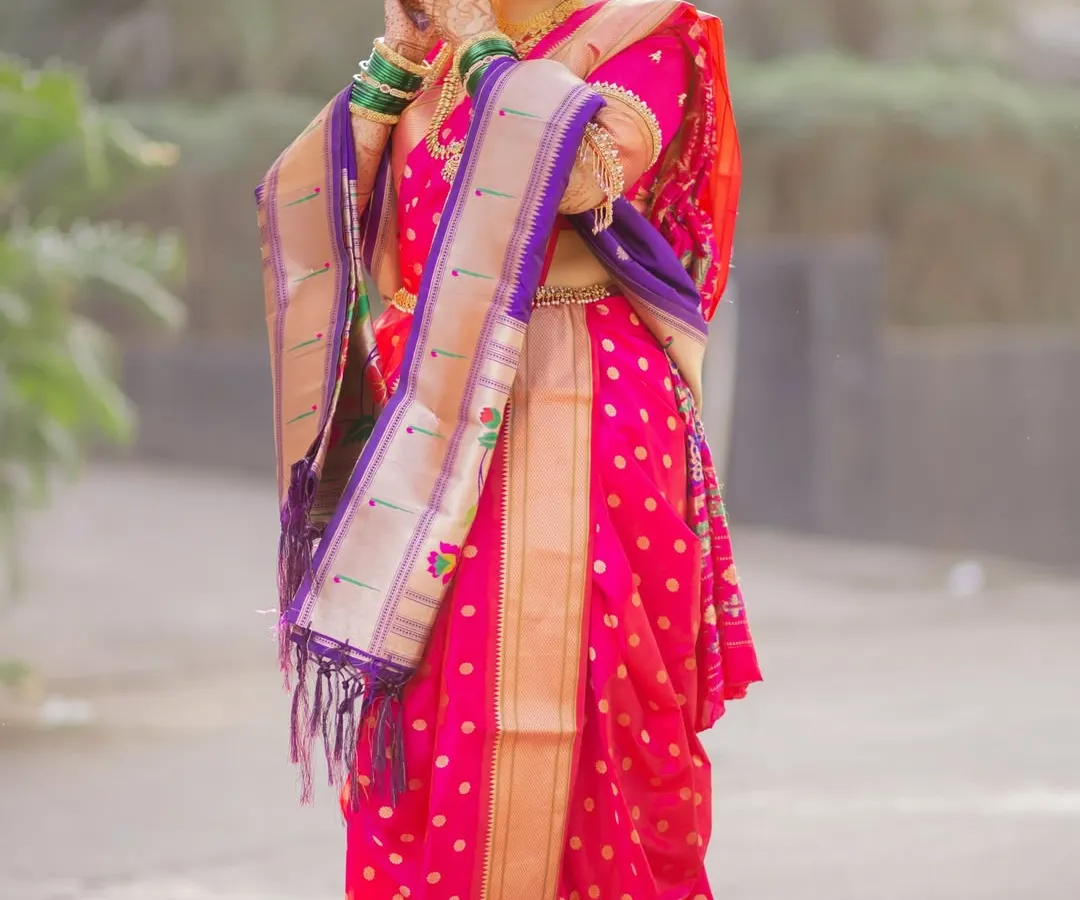 My beautiful bride glowing in her stunning pink Nauvari. I ensure the draping is not only perfect for photos but also comfortable enough to let you enjoy every moment of your big day.