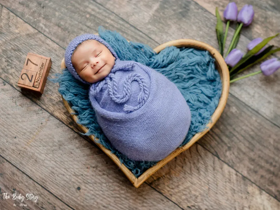 Capturing a newborn's first smile is pure magic. I use careful timing and a comfortable environment in my studio to catch these fleeting, precious expressions.