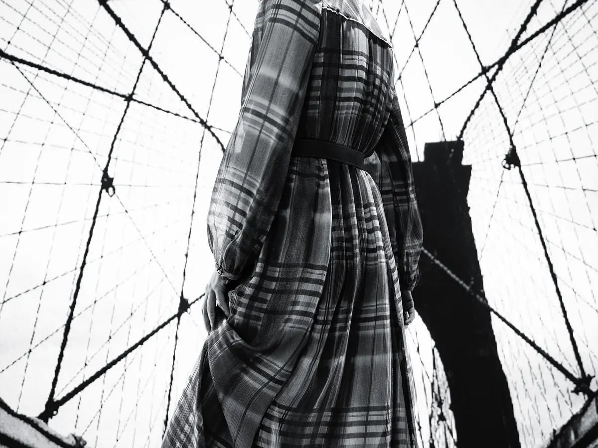 Creating a powerful editorial moment in New York. I chose this flowing plaid dress to contrast with the graphic lines of the Brooklyn Bridge, giving it a high-fashion, metropolitan feel for this model's portfolio.