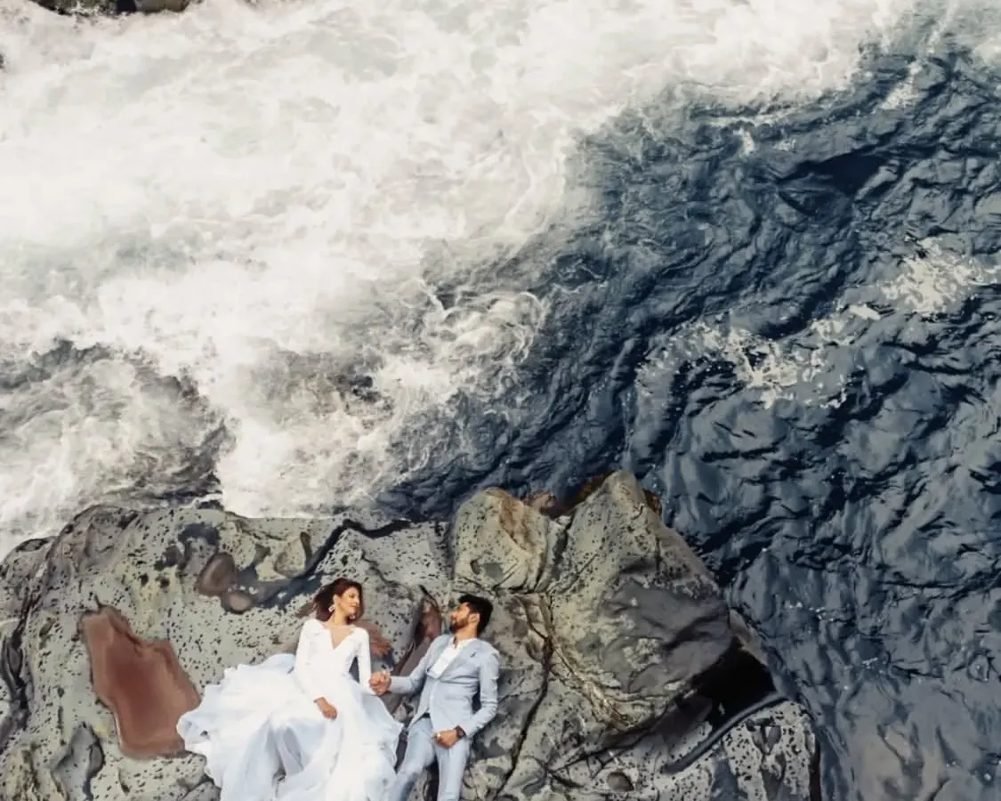 We traveled to the heart of Kashmir for this shot, placing our couple amidst the raw power of nature. This aerial view, captured with our drone, shows how we use dramatic landscapes to create unforgettable, larger-than-life portraits that tell a story of adventure and love.