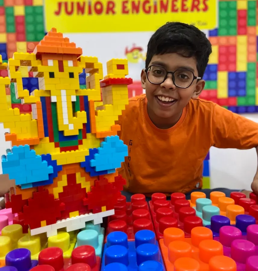 A proud student shows off the large, colorful LEGO Ganesha idol he built during our popular festive workshop. This is a perfect example of how we blend cultural traditions with hands-on engineering skills.