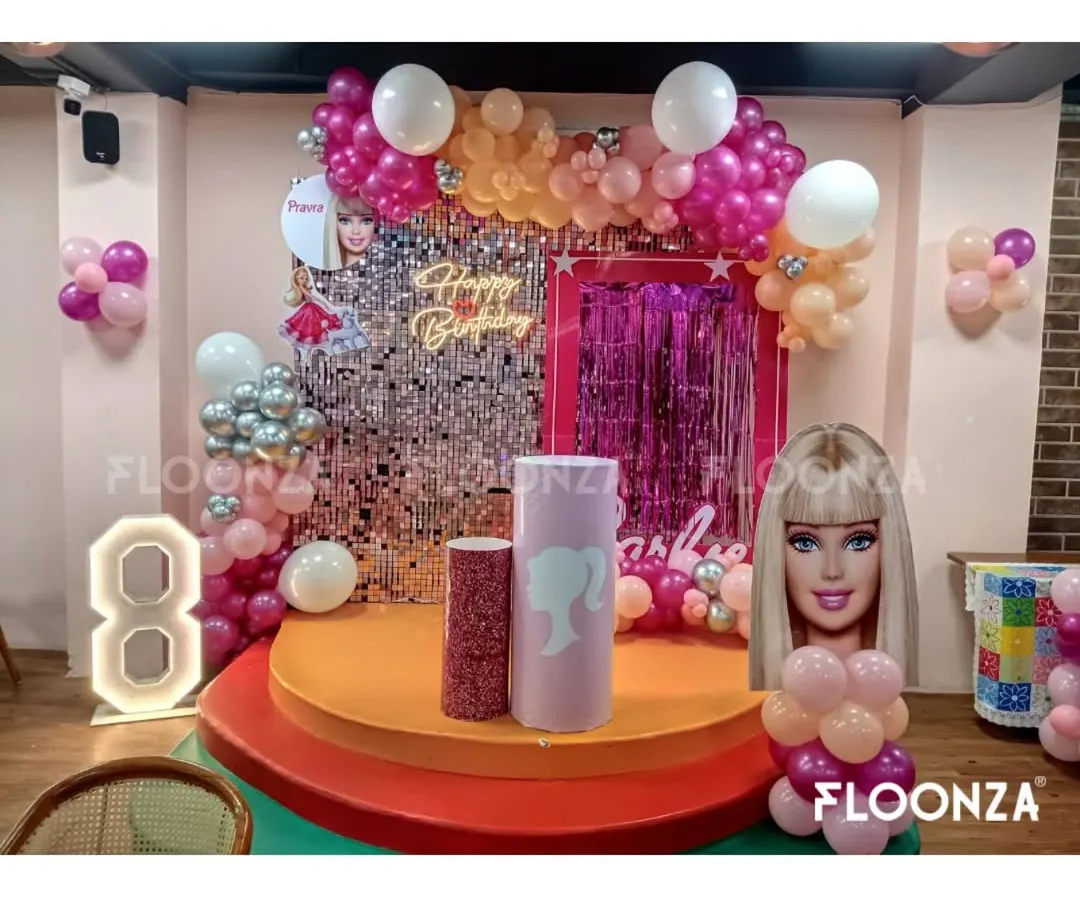 A complete Barbie-themed birthday party setup for an 8th birthday celebration. I handled everything from the silver sequin and pink fringe backdrop to the custom Barbie cutouts, marquee number, and themed cake pedestals.