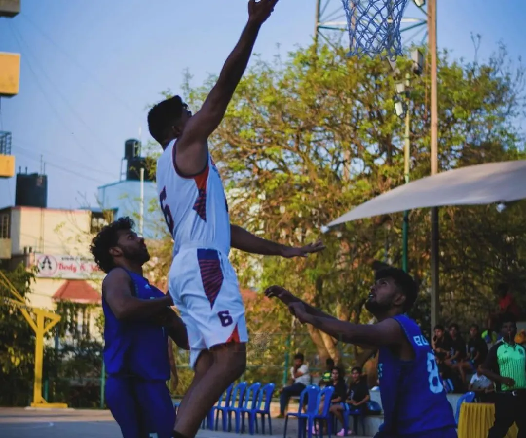 I don't just talk about the game, I live it. This is me during a state-level tournament, finishing a layup through contact. This is the kind of in-game experience and pressure I bring to our training sessions to prepare you for actual competition.