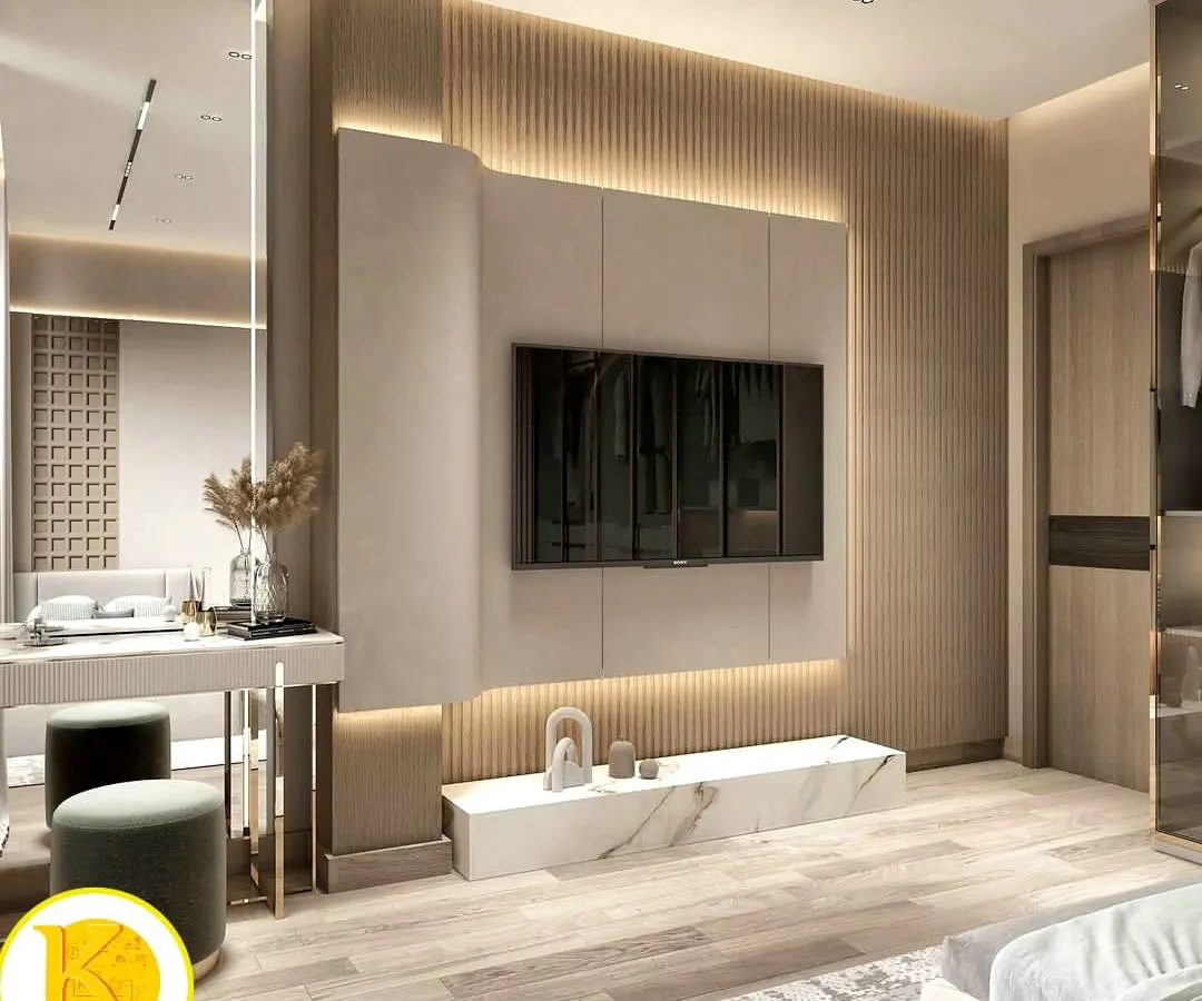 We designed this premium master bedroom to be a sanctuary of comfort and style. The space features a floor-to-ceiling fluted wood panel behind the TV, a marble-finish console, and a chic integrated dressing table, all tied together with warm, ambient lighting.