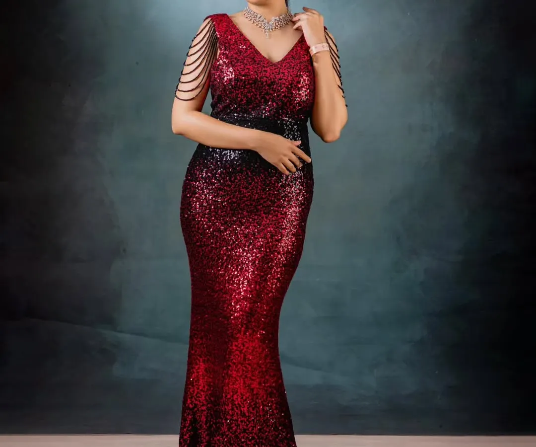 For moments that demand glamour, I designed this red and black ombré sequin gown. The mermaid silhouette is crafted to celebrate your curves, while the draped pearl shoulder details add a touch of modern royalty.