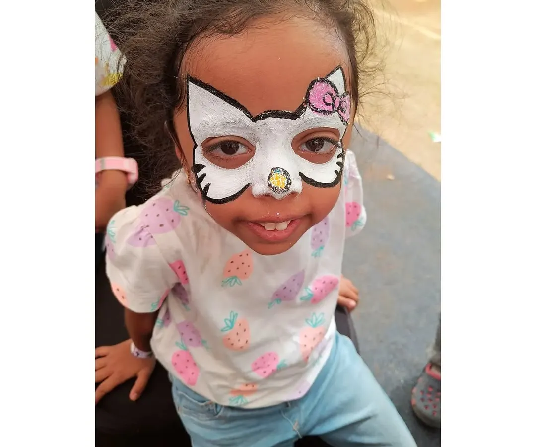 Here's a super cute Hello Kitty full-face design. I focus on clean lines and the signature pink bow to bring this adorable character to life for your little one's special day.