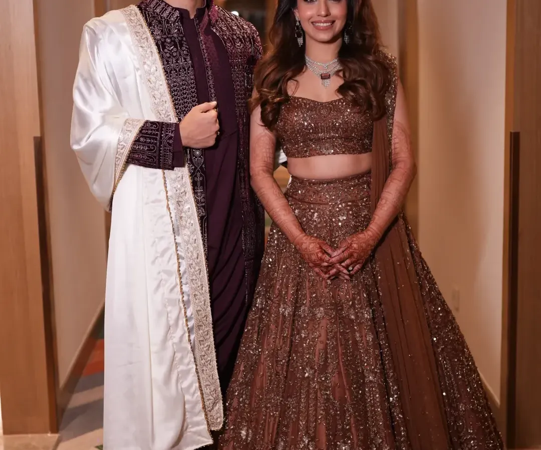 This is what it's all about: a perfectly styled couple, confident and happy. I worked with this lovely bride and groom to create complementary looks that reflect their individual personalities while looking stunning together. This is the result of careful planning, from the bride's shimmering lehenga to the groom's coordinated sherwani.