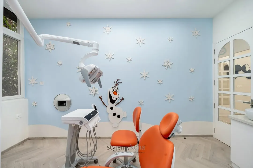 To make a pediatric dental clinic feel less intimidating, I brought the magic of Disney's 'Frozen' to life. This treatment room features a cheerful Olaf, snowflake wall details, and a calming blue palette, creating a friendly and stress-free environment for young patients.