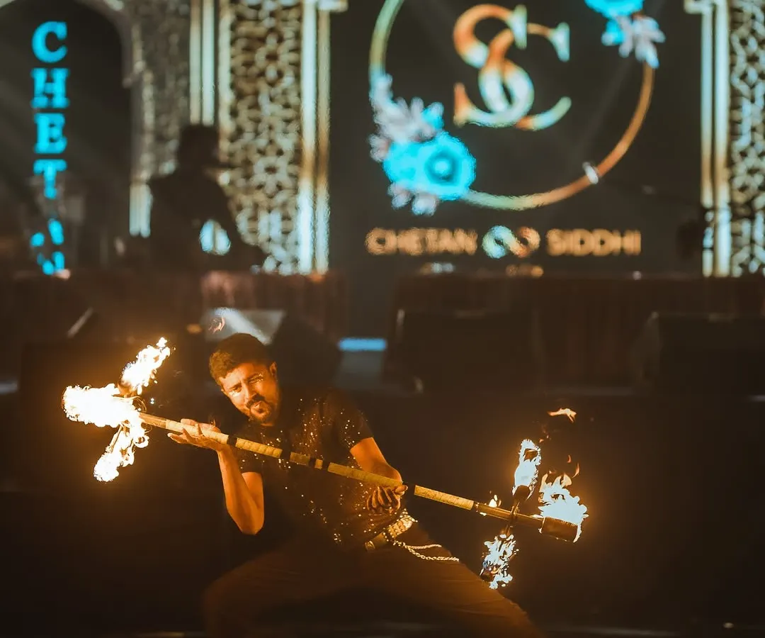 A powerful moment captured during a Sufi-themed wedding. Using a fire dragon staff, I can create dramatic, impactful poses like this that make for incredible photos and memories on your special day.