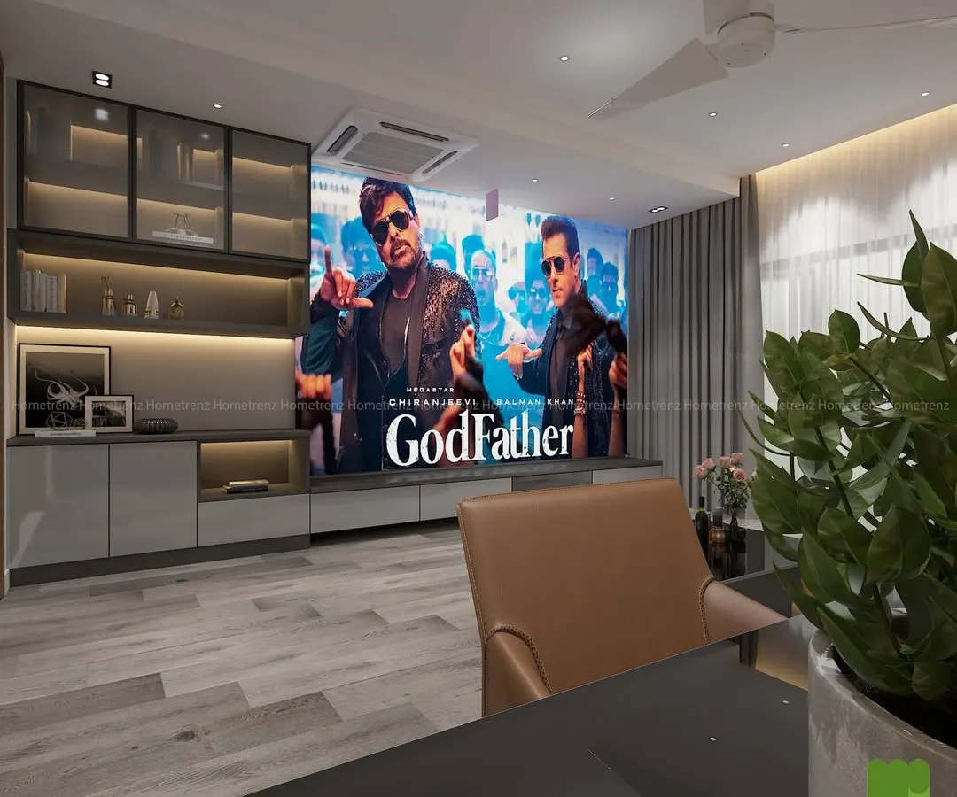 A living room can become a cinematic paradise. Here, a high-definition projector screen descends from the ceiling, complemented by a bespoke entertainment unit that keeps the space elegant and functional for everyday life.