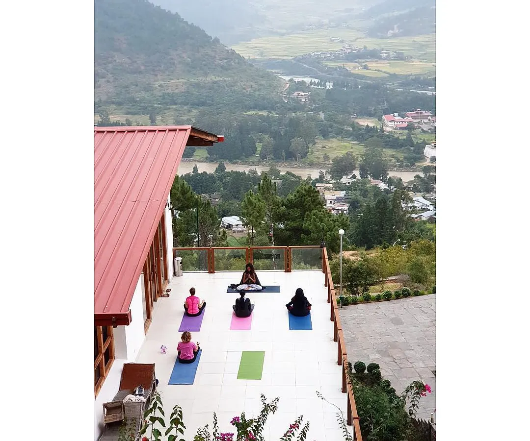 A glimpse into our morning practice during a wellness retreat in Bhutan. We gather on a terrace with an open view of the Punakha valley and its winding rivers. Leading a group yoga session in such a majestic space allows us all to connect more deeply with our breath and each other.