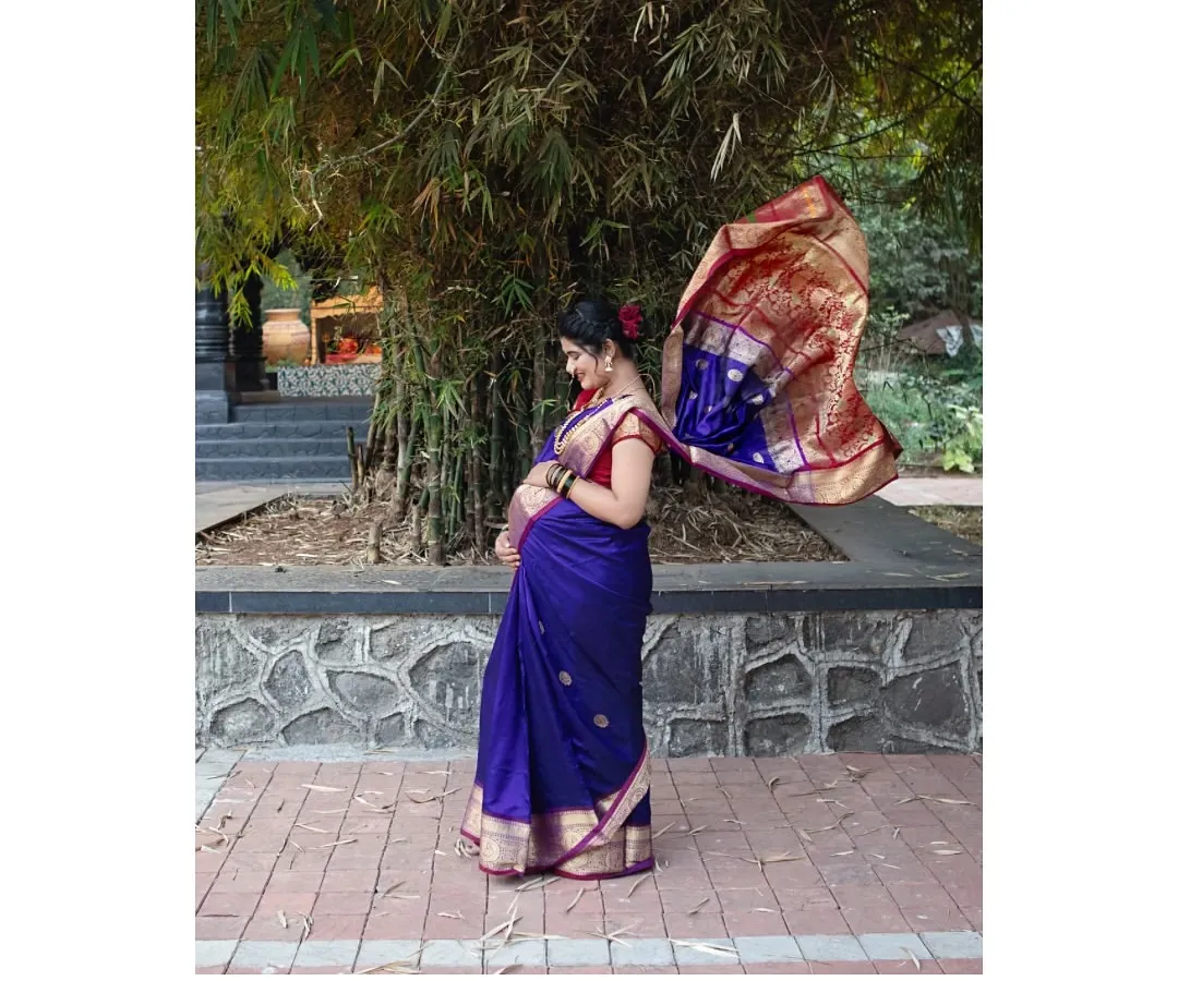 There is a special kind of grace in tradition. For this outdoor shoot, we used a beautiful flowing saree to create a timeless portrait that feels both divine and deeply personal, celebrating motherhood as a blessing.