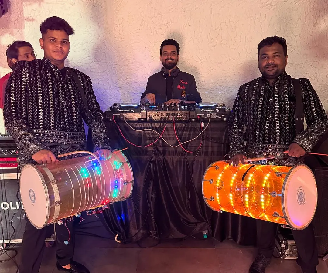 For a truly authentic desi wedding or sangeet, I collaborate with live dhol players. This fusion of my DJ set with live dhol beats creates an electrifying atmosphere for the baraat or dance floor.