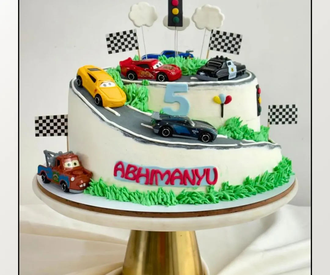 Who says you need fondant for a fun theme? This 3kg car-themed cake is covered in my signature, silky buttercream. Inside, it's packed with rich chocolate layers and my special in-house orange marmalade.