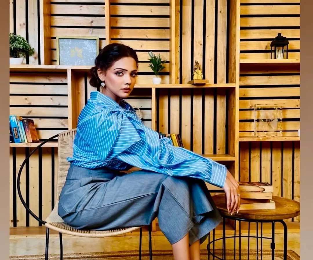 For this corporate fashion shoot, the goal was a look that felt powerful and polished. I focused on clean lines, subtly defined eyes, and a neutral lip to complement the 'power dressing' theme, ensuring the makeup enhanced the model's confident presence without overpowering the clothing.